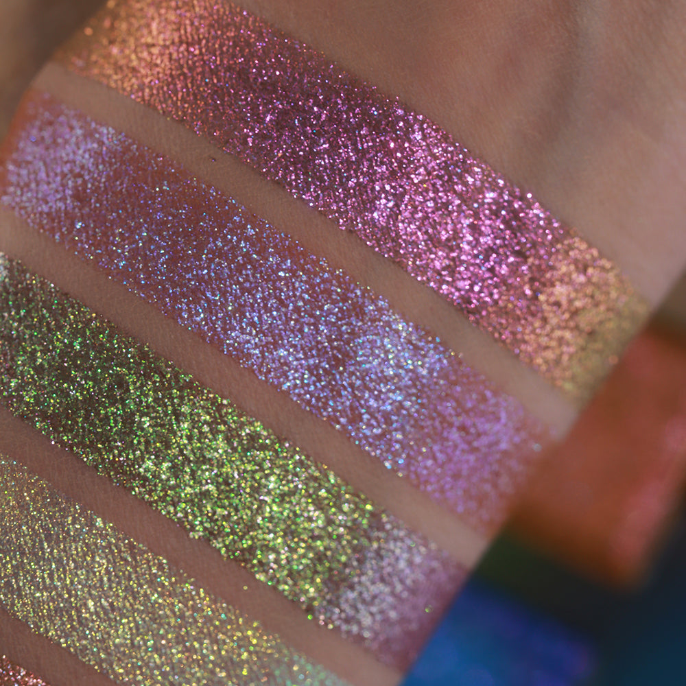 Close-up of four swatches from the Galápagos Palette on fair skin.