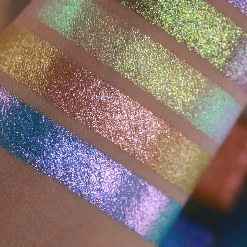 Close-up of four swatches from the Galápagos Palette on fair skin.